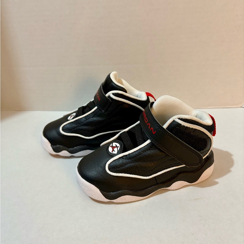 Jordan Kids Black and White High-Top Sneakers
